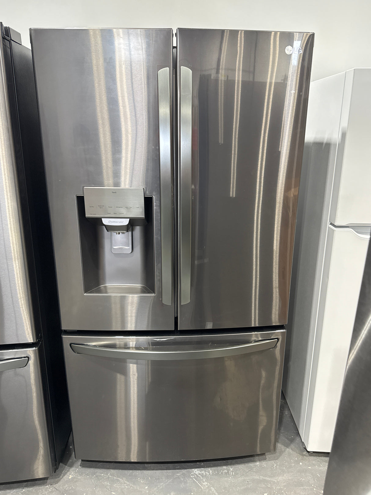 LRFS28XBD - REFRIGERATORS - LG - French 3-Door -   Black Stainless Steel - Open Box